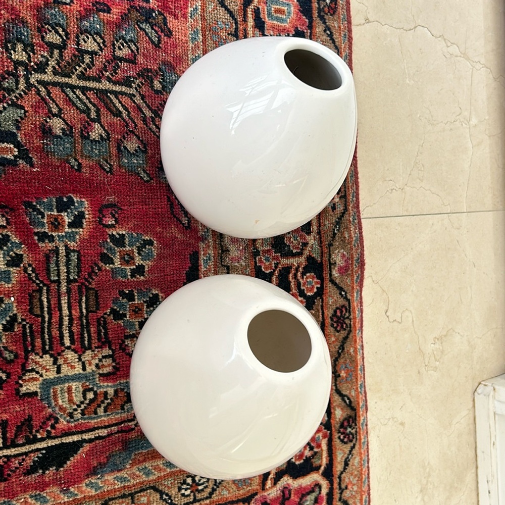 Set of two white egg shapes pottery vase
